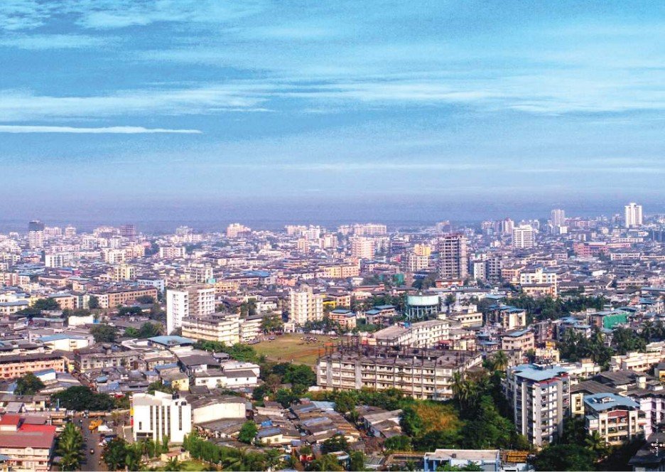 Luxury tower exterior with panoramic daytime city view from above