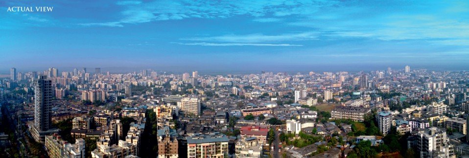 Luxury tower exterior with panoramic daytime city view from above